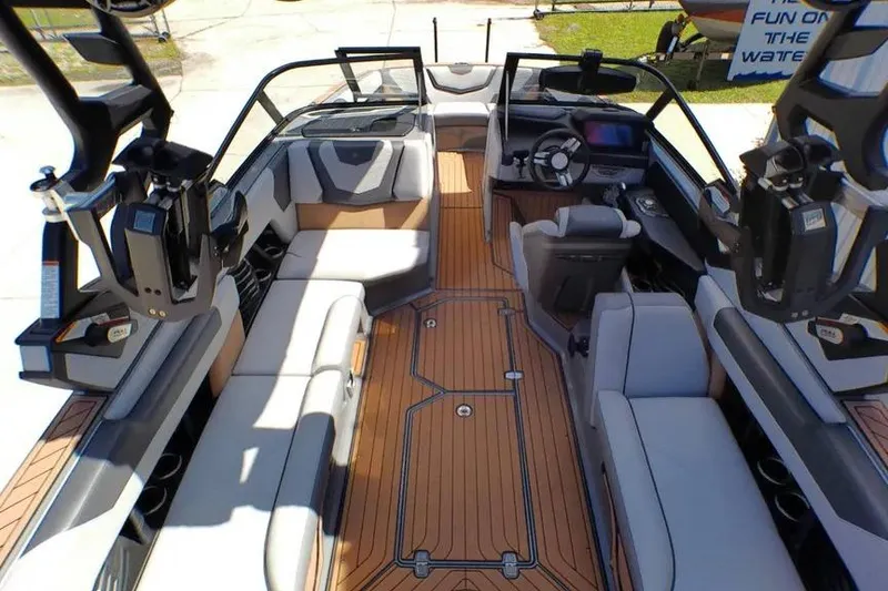 Slide: The Image of 2021 Nautique Super Air Nautique G23 Coastal Edition interior with luxurious seating and advanced controls. - 11