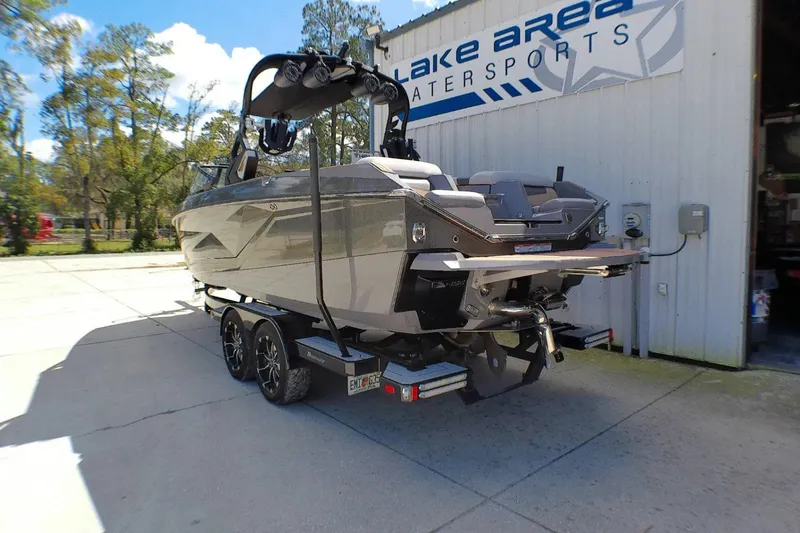 Slide: The Image of 2021 Nautique Super Air Nautique G23 Coastal Edition boat on trailer at Lake Area Watersports. - 3