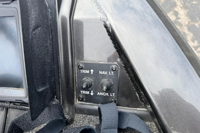 Slide: The Image of Control panel of a 2020 Vexus AVX1880 boat with trim and light switches. - 10