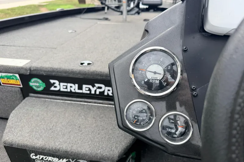 Slide: The Image of Dashboard of a 2020 Vexus AVX1880 boat featuring RPM, water pressure, and trim gauges. - 16