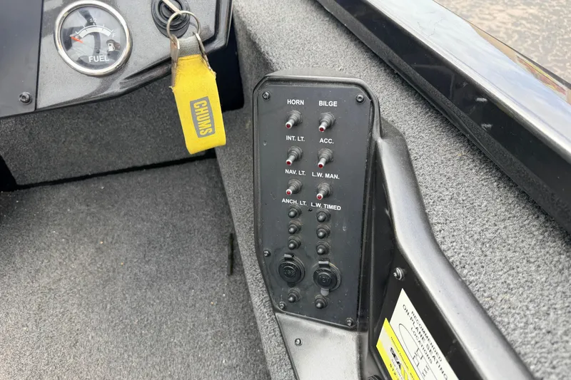 Slide: The Image of Control panel of a 2020 Vexus AVX1880 boat with switches and fuel gauge. - 17