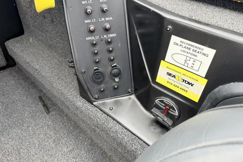Slide: The Image of Control panel of a 2020 Vexus AVX1880 boat with seating instructions and Sea Tow sticker. - 19