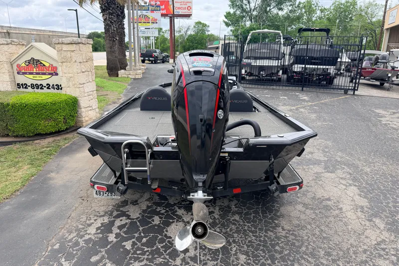 Slide: The Image of 2020 Vexus AVX1880 boat with outboard motor, parked at South Austin dealership. - 2