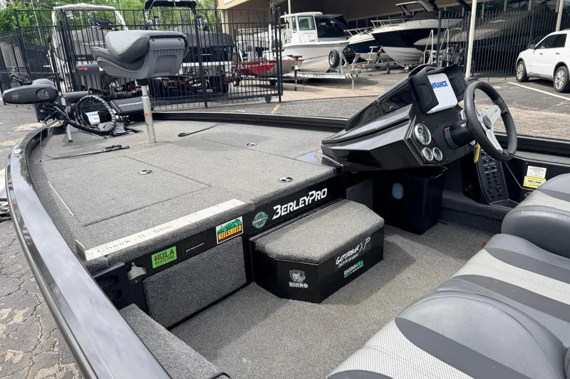 Slide: The Image of 2020 Vexus AVX1880 boat interior with steering console and seating, showcasing fishing equipment. - 23