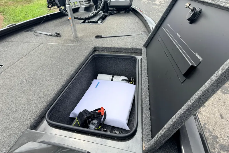 Slide: The Image of Open storage compartment in a 2020 Vexus AVX1880 boat, showing equipment and accessories. - 28