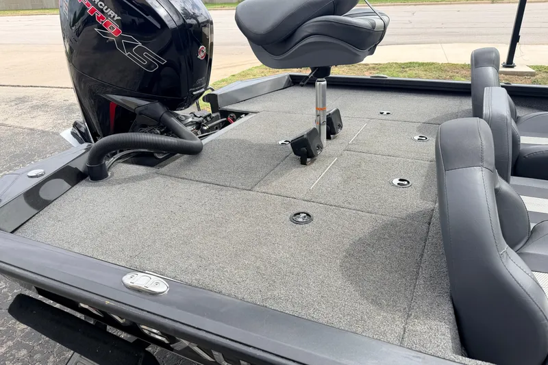 Slide: The Image of 2020 Vexus AVX1880 boat interior with Mercury Pro XS engine, featuring gray seating and carpeted deck. - 29