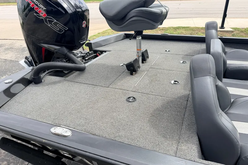 Slide: The Image of 2020 Vexus AVX1880 boat interior with Mercury Pro XS engine, featuring gray seating and carpeted deck. - 30