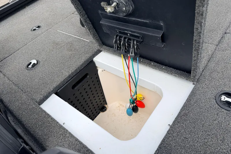Slide: The Image of 2020 Vexus AVX1880 boat storage compartment with colorful cables and secure latches. - 35