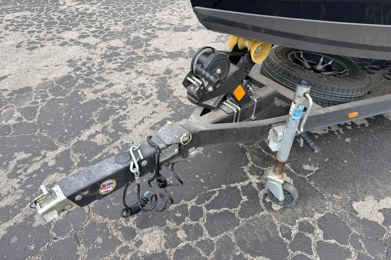 Slide: The Image of Trailer hitch of 2020 Vexus AVX1880 boat on cracked asphalt surface. - 4