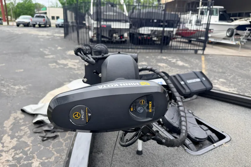 Slide: The Image of 2020 Vexus AVX1880 boat with Minn Kota Ultrex trolling motor in a parking lot. - 6
