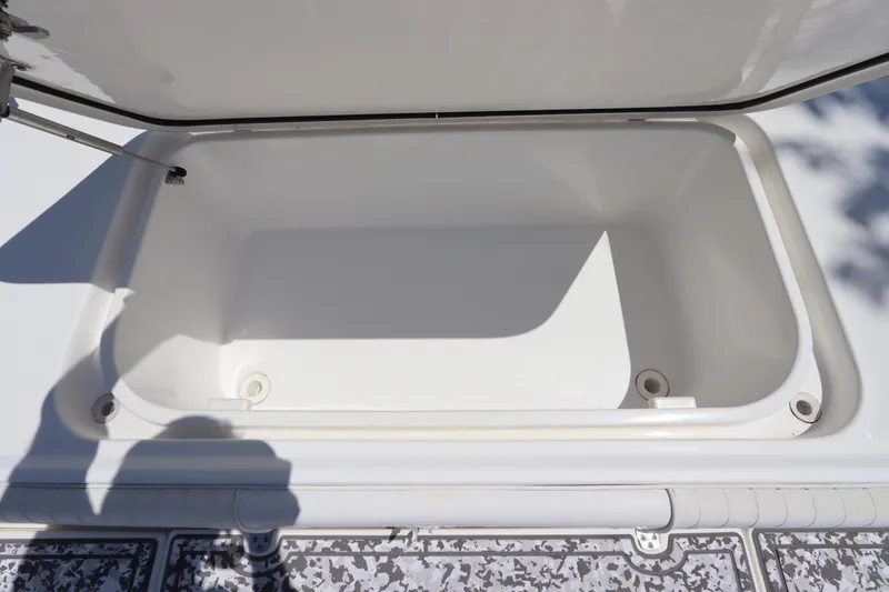 Slide: The Image of Open storage compartment on a 2014 Canyon Bay 2400 boat. - 30