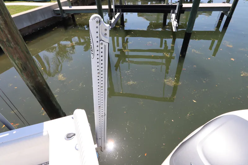 Slide: The Image of 2014 Canyon Bay 2400 boat with Power-Pole anchor in a marina setting. - 7