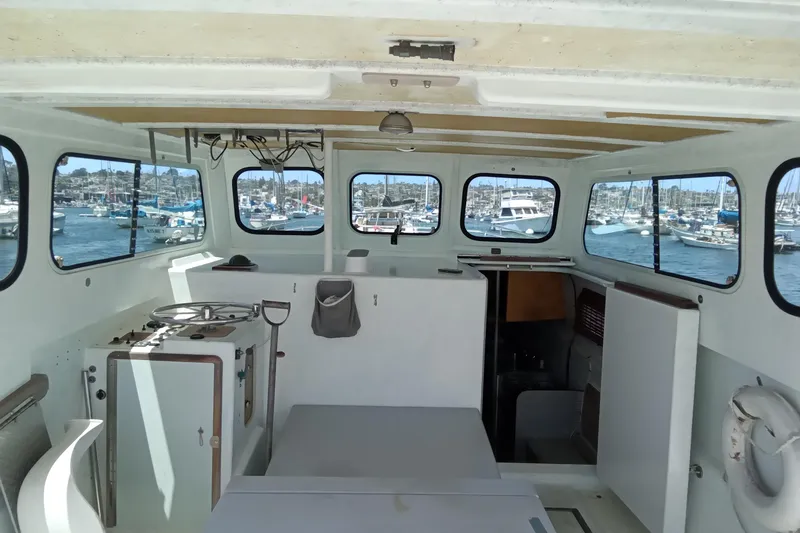 Slide: The Image of Interior of a 1972 Uniflight 40 boat with harbor view through windows. - 5