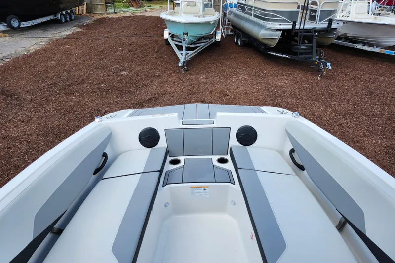 Slide: The Image of 2026 Starcraft SV 16 OB boat interior with gray seating and cup holders. - 12