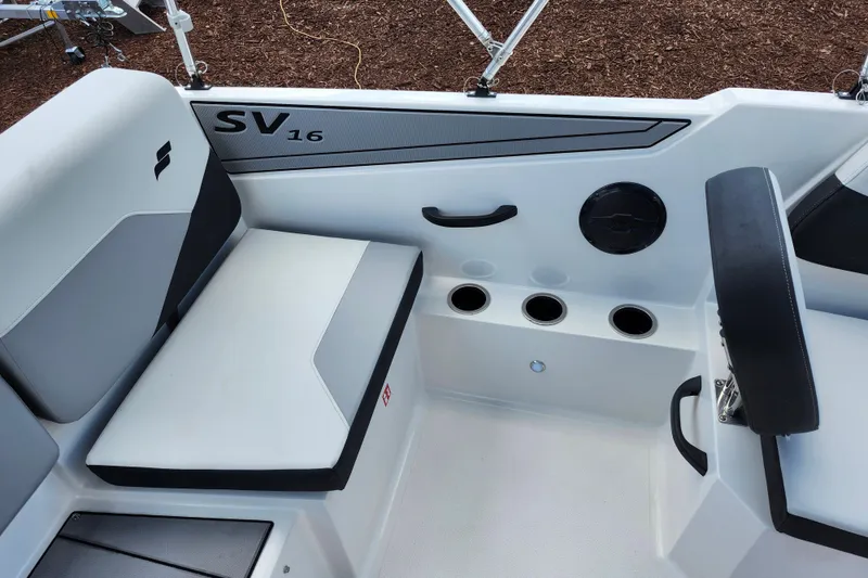 Slide: The Image of Interior of 2026 Starcraft SV 16 OB boat with seating and cup holders. - 14