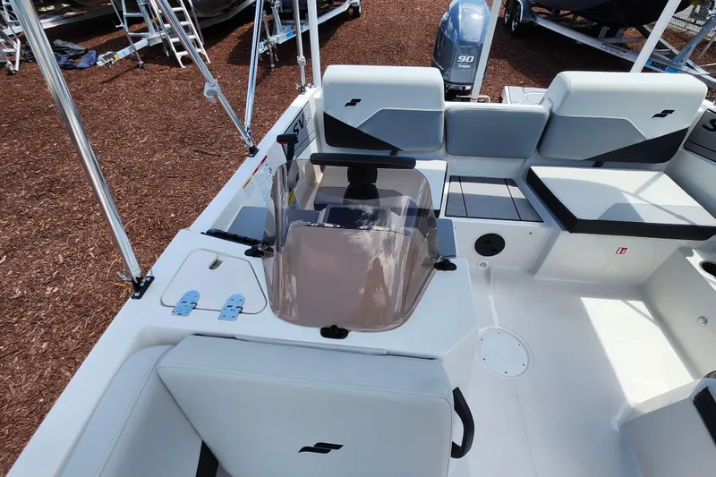 Slide: The Image of 2026 Starcraft SV 16 OB boat interior with seating and console, featuring modern design elements. - 21