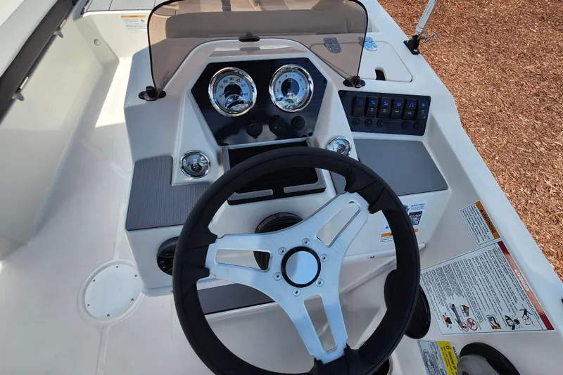Slide: The Image of Steering console of 2026 Starcraft SV 16 OB boat with gauges and controls. - 22