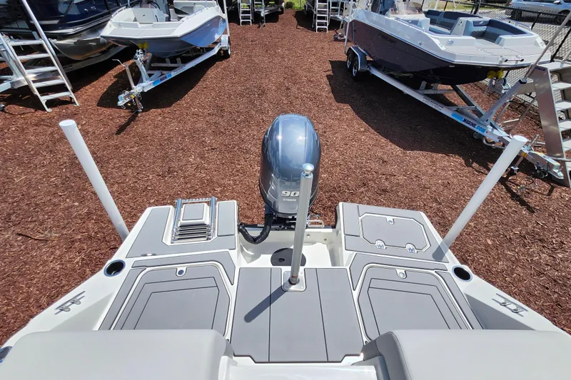 Slide: The Image of 2026 Starcraft SV 16 OB boat with Yamaha 90 engine, displayed on mulch ground. - 25