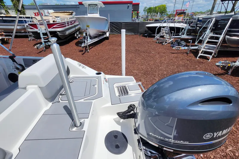 Slide: The Image of 2026 Starcraft SV 16 OB boat with Yamaha outboard motor in a dealership lot. - 26