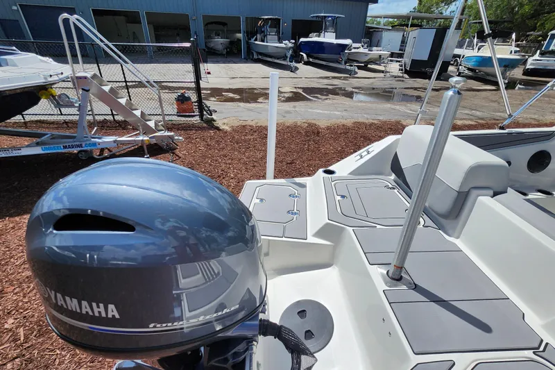Slide: The Image of 2026 Starcraft SV 16 OB boat with Yamaha engine in a marina setting. - 27