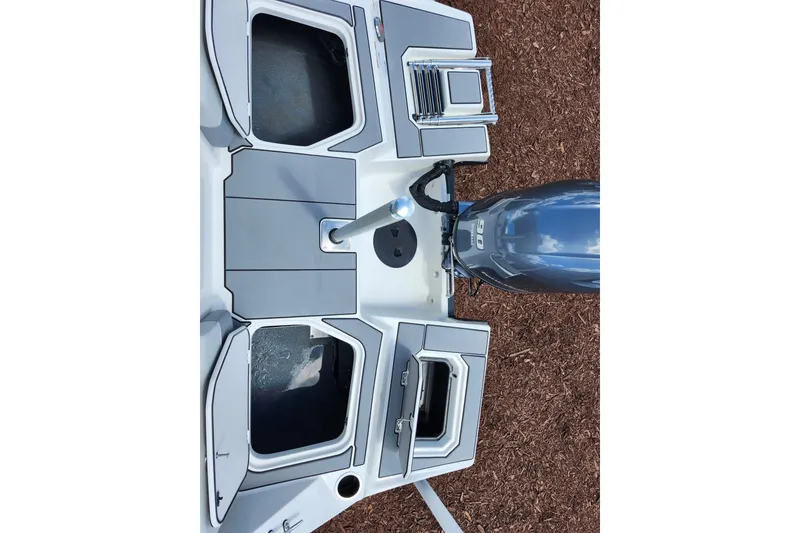 Slide: The Image of Top view of 2026 Starcraft SV 16 OB boat with outboard motor and storage compartments. - 29