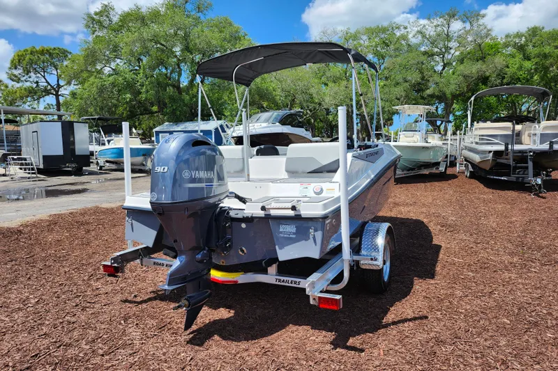 Slide: The Image of 2026 Starcraft SV 16 OB boat with Yamaha 90 engine on a trailer, parked outdoors. - 8