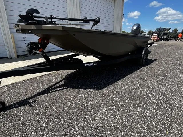 Slide: The Image of 2026 Thor 1754 FISH HAMMER boat in green on trailer. - 14