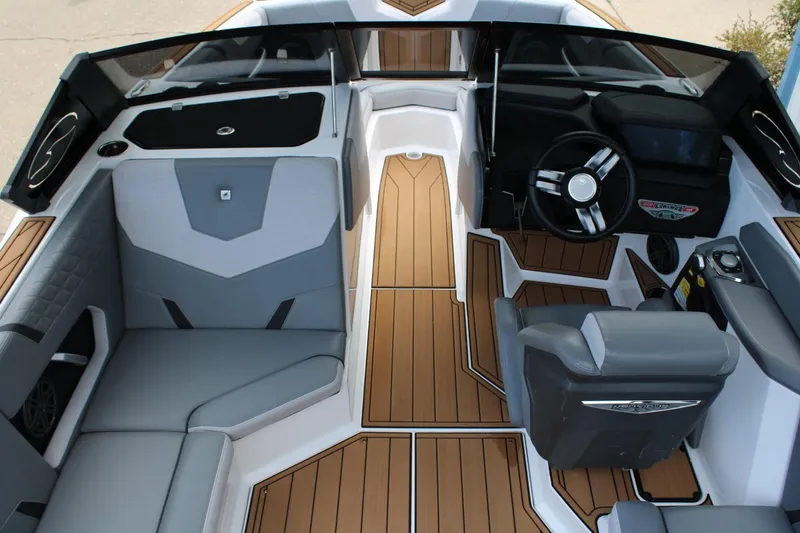 Slide: The Image of 2023 Nautique Super Air Nautique GS20 interior with sleek seating and modern dashboard design. - 11