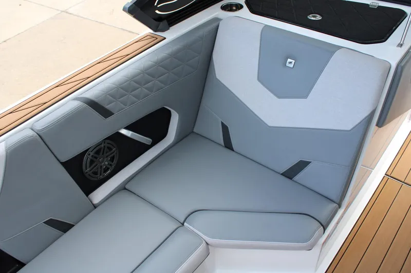 Slide: The Image of 2023 Nautique Super Air Nautique GS20 interior with sleek gray seating and modern design. - 13