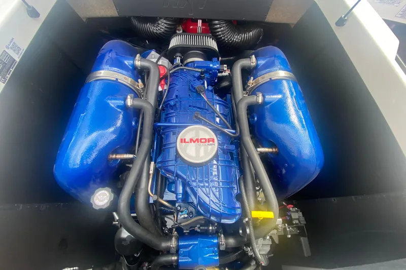 Slide: The Image of 2023 MasterCraft NXT21 engine with blue Ilmor components, showcasing advanced marine engineering. - 13