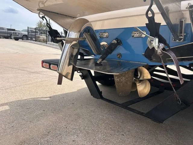 Slide: The Image of Rear view of a 2018 Supra SL boat with propeller. - 11