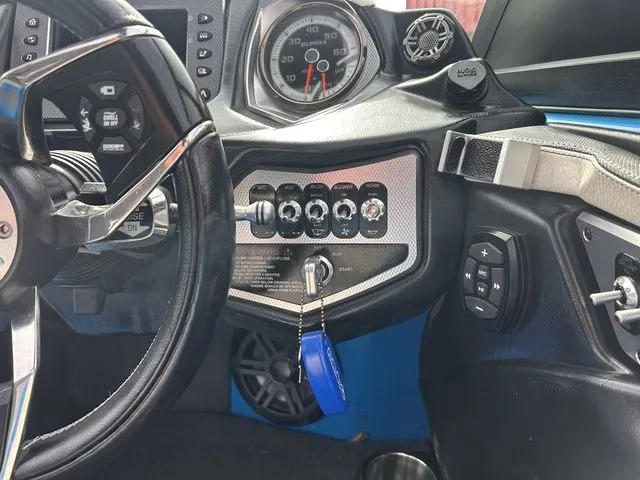Slide: The Image of Interior of a 2018 Supra SL with dashboard and controls. - 19