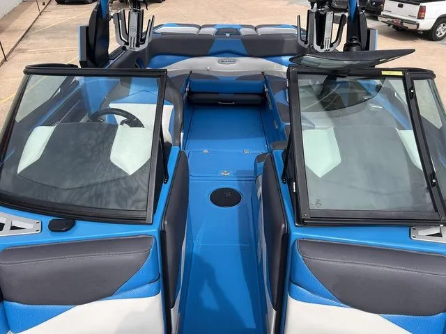 Slide: The Image of Interior of a blue 2018 Supra SL boat with modern seating. - 23