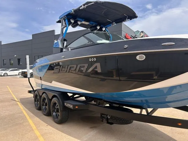 Slide: The Image of 2018 Supra SL boat on trailer, side view. - 5