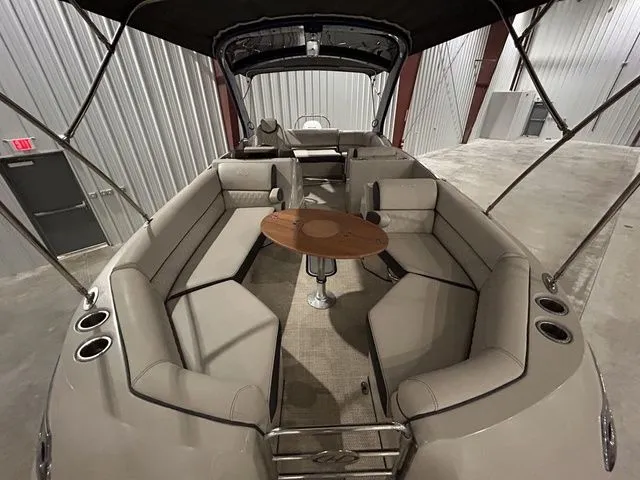 Slide: The Image of Interior view of a 2017 Harris Crowne Series SL 250 boat with seating area. - 12
