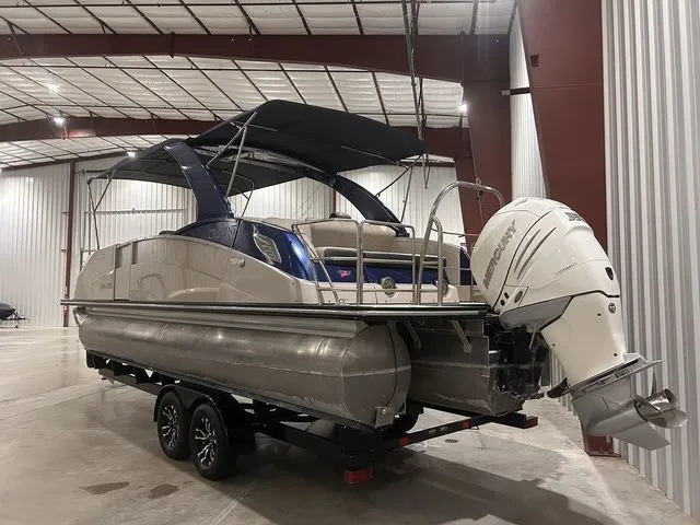 Slide: The Image of 2017 Harris Crowne Series SL 250 pontoon boat in warehouse. - 8