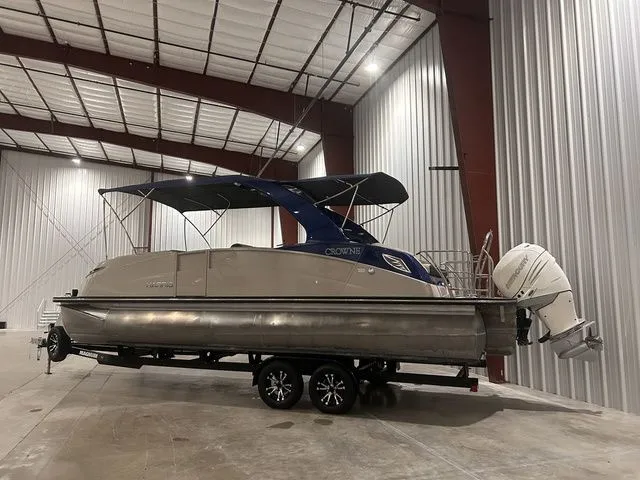 Slide: The Image of 2017 Harris Crowne Series SL 250 pontoon boat in warehouse. - 9
