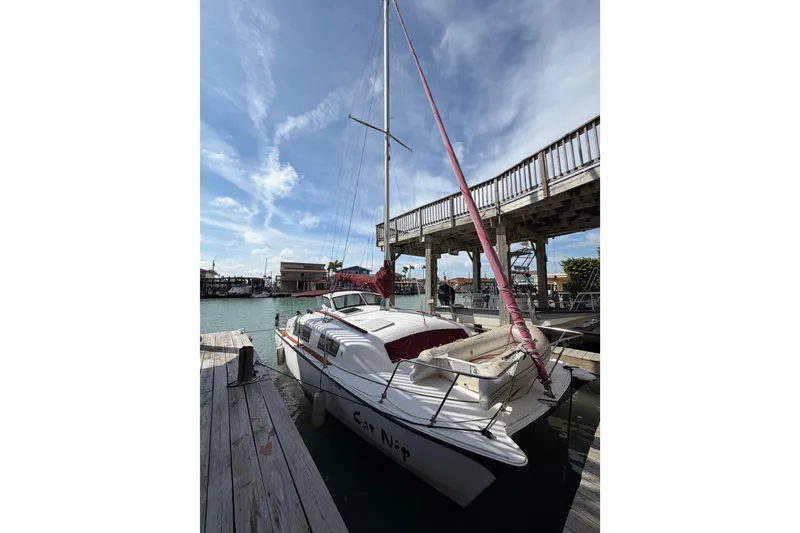 The Image of 1989 Gemini 3000 sailboat docked under a clear blue sky. - 1