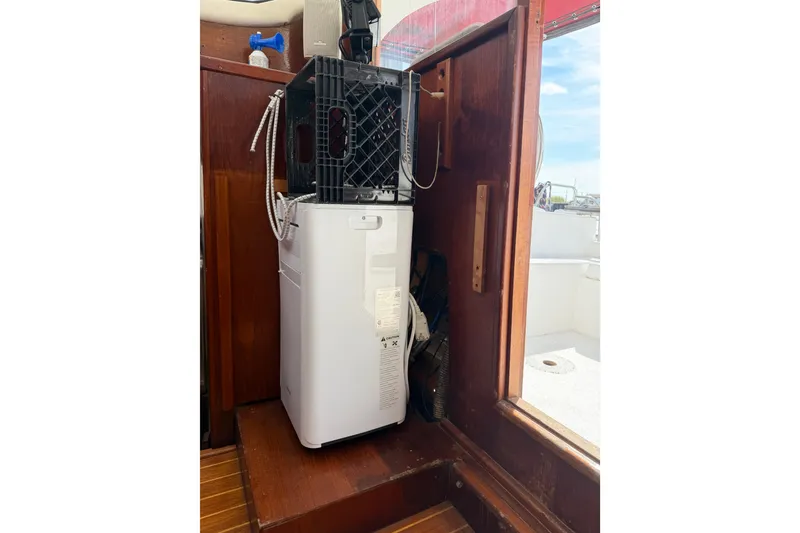 Slide: The Image of Portable air conditioner inside a 1989 Gemini 3000 boat cabin. - 10