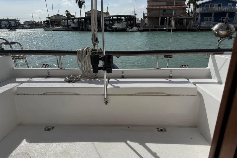 Slide: The Image of Cockpit view of a 1989 Gemini 3000 sailboat docked in a sunny marina. - 5