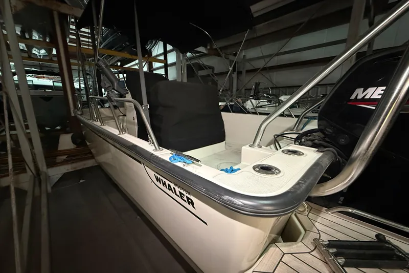 Slide: The Image of 2020 Boston Whaler 170 Montauk boat in storage, showcasing interior and exterior details. - 13