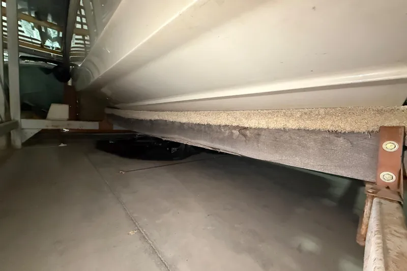 Slide: The Image of 2020 Boston Whaler 170 Montauk boat hull in storage, showing underside details. - 15