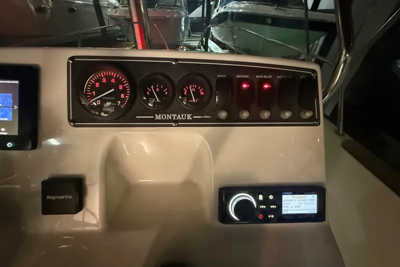 Slide: The Image of Control panel of a 2020 Boston Whaler 170 Montauk boat with gauges and switches. - 21