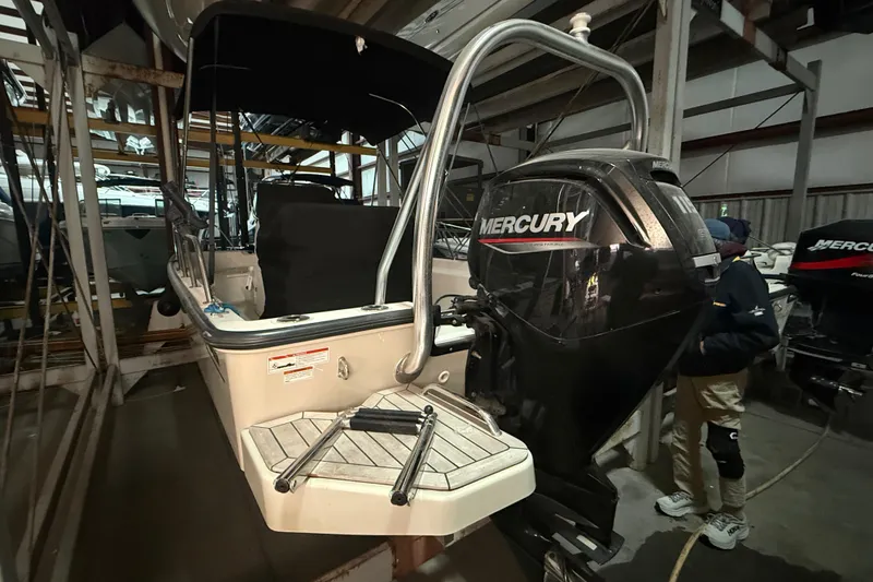 Slide: The Image of 2020 Boston Whaler 170 Montauk with Mercury outboard engine in storage facility. - 3