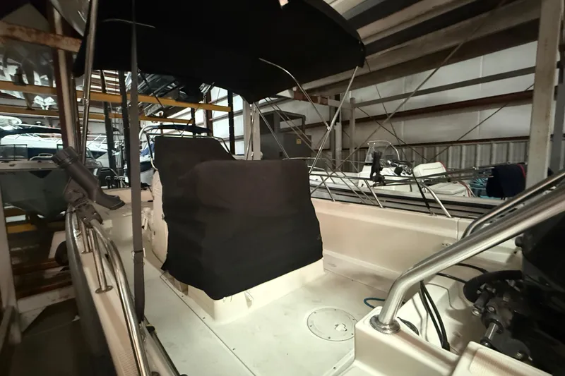 Slide: The Image of 2020 Boston Whaler 170 Montauk boat stored indoors with protective covers. - 4