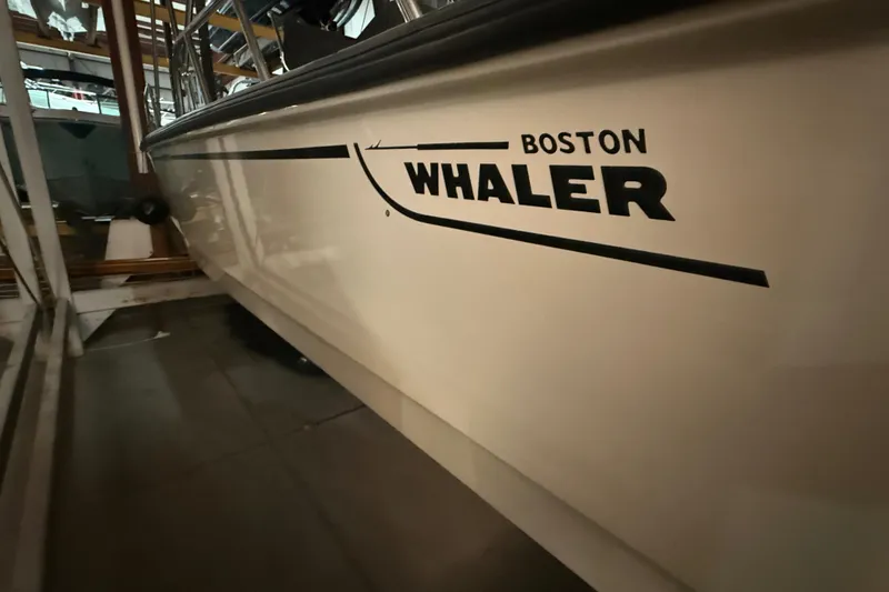 Slide: The Image of 2020 Boston Whaler 170 Montauk boat side view in storage facility. - 5
