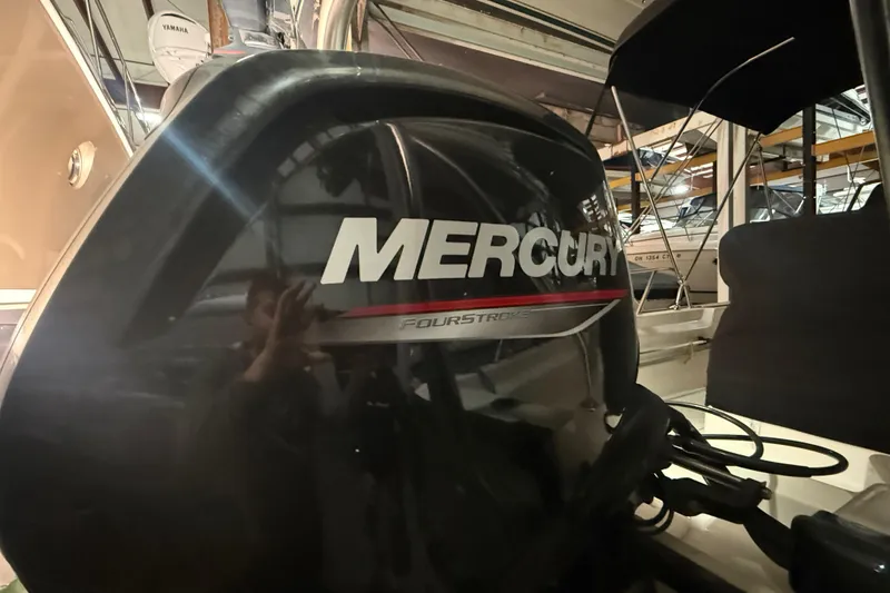 Slide: The Image of Mercury FourStroke engine on a 2020 Boston Whaler 170 Montauk boat in storage. - 7