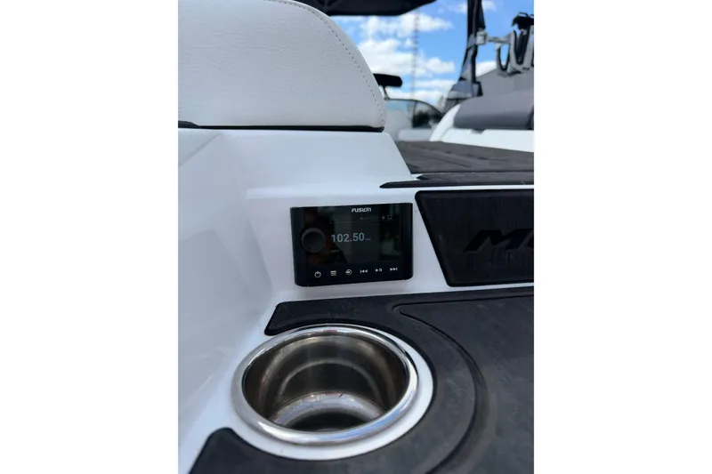Slide: The Image of 2025 Moomba Makai boat interior with Fusion stereo and cup holder. - 12