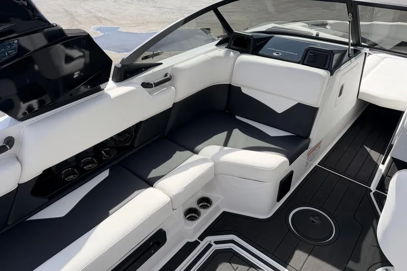 Slide: The Image of 2025 Moomba Makai boat interior with sleek white and gray seating and modern design. - 16