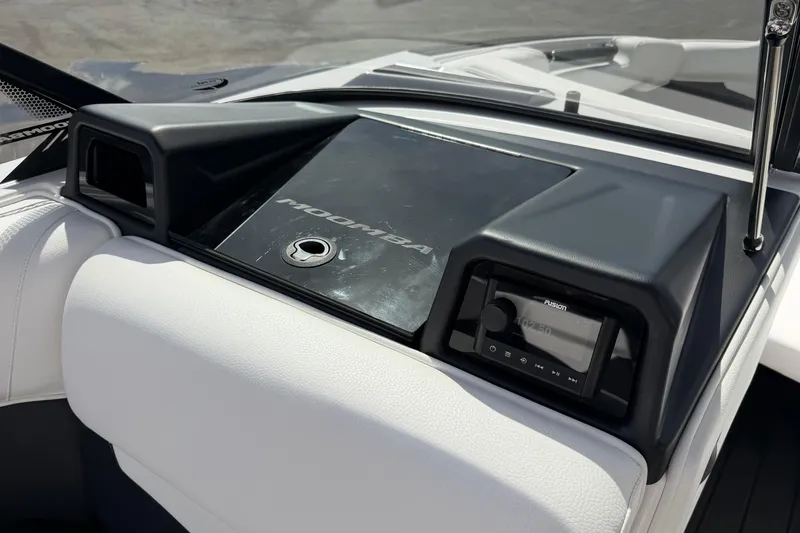 Slide: The Image of 2025 Moomba Makai dashboard featuring sleek design and integrated Fusion audio system. - 18
